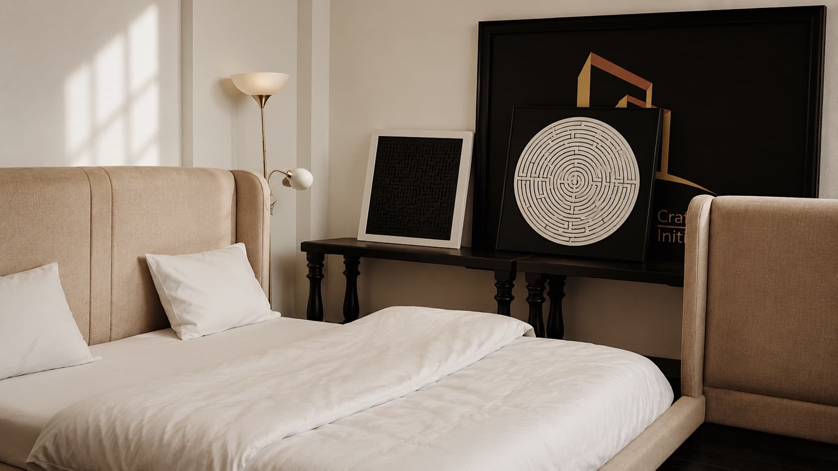 An NDB upholstered bed in oatmeal linen with white bedding, beside a dark turned-leg console.